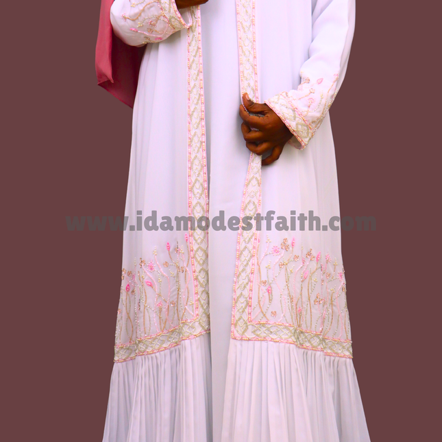 White Fancy Princess Embroidered Abaya, Crafted from premium imported Korean Nida fabric, this abaya offers a silky-soft touch, effortless flow, and regal elegance.