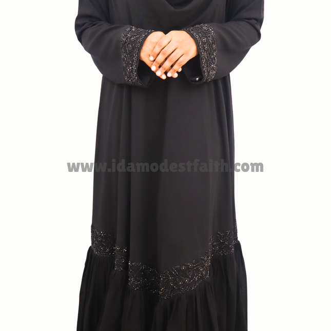 Black Fancy Embroidered Abaya, . Made from premium imported Korean Nida fabric,he chiffon frill at the bottom adds a dreamy, feminine touch, making it a one-of-a-kind design you won’t find in any retail store!
